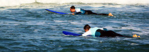 go surf with a friend in praia azul