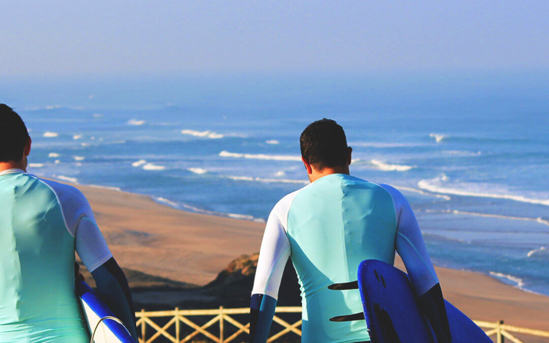 Atlantic Coast Surf School surf lesson starts with 2 surfers walking to the beach in Praia Azul - Santa Cruz
