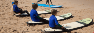 Surf lessons for kids at the beach with Atlantic Coast Surf School