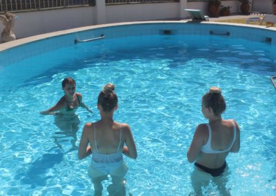 surf girls in a swimming pool having fun